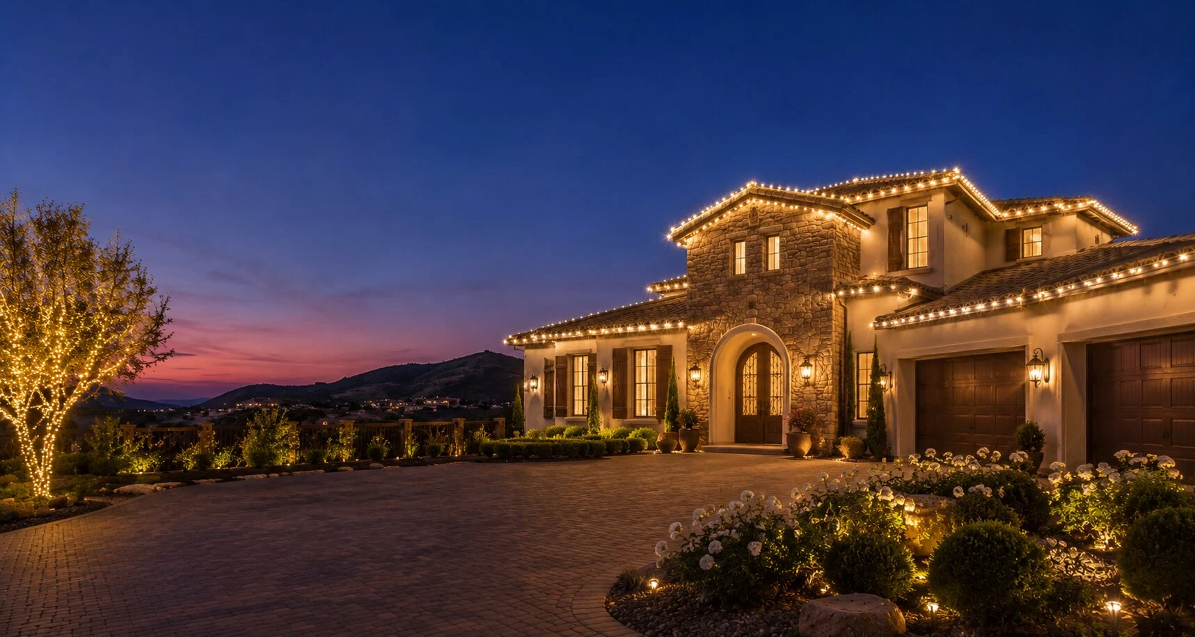 Christmas lights traced along a Temecula rooflines at dusk