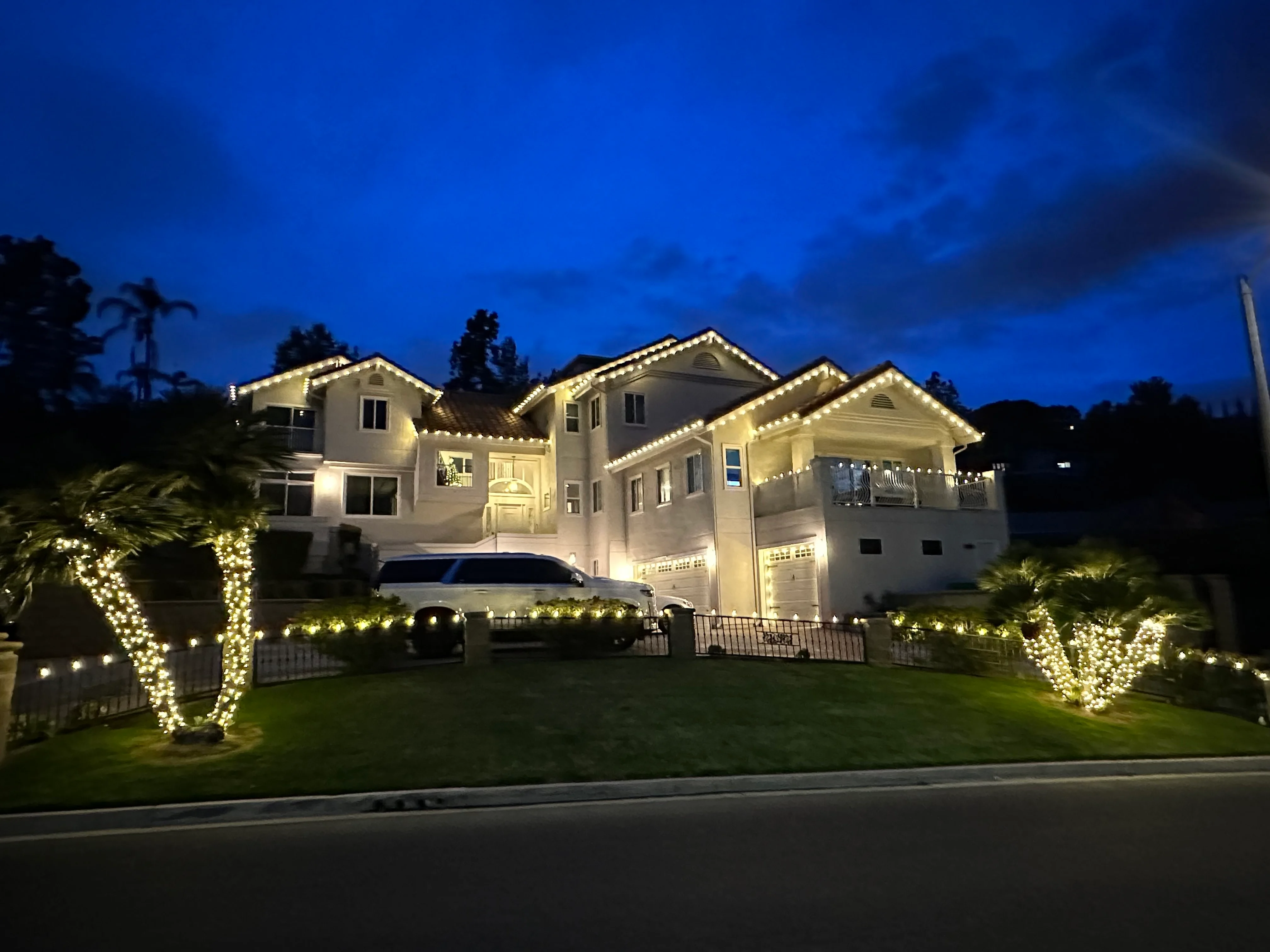 Warm-white holiday lighting on a Southern California estate