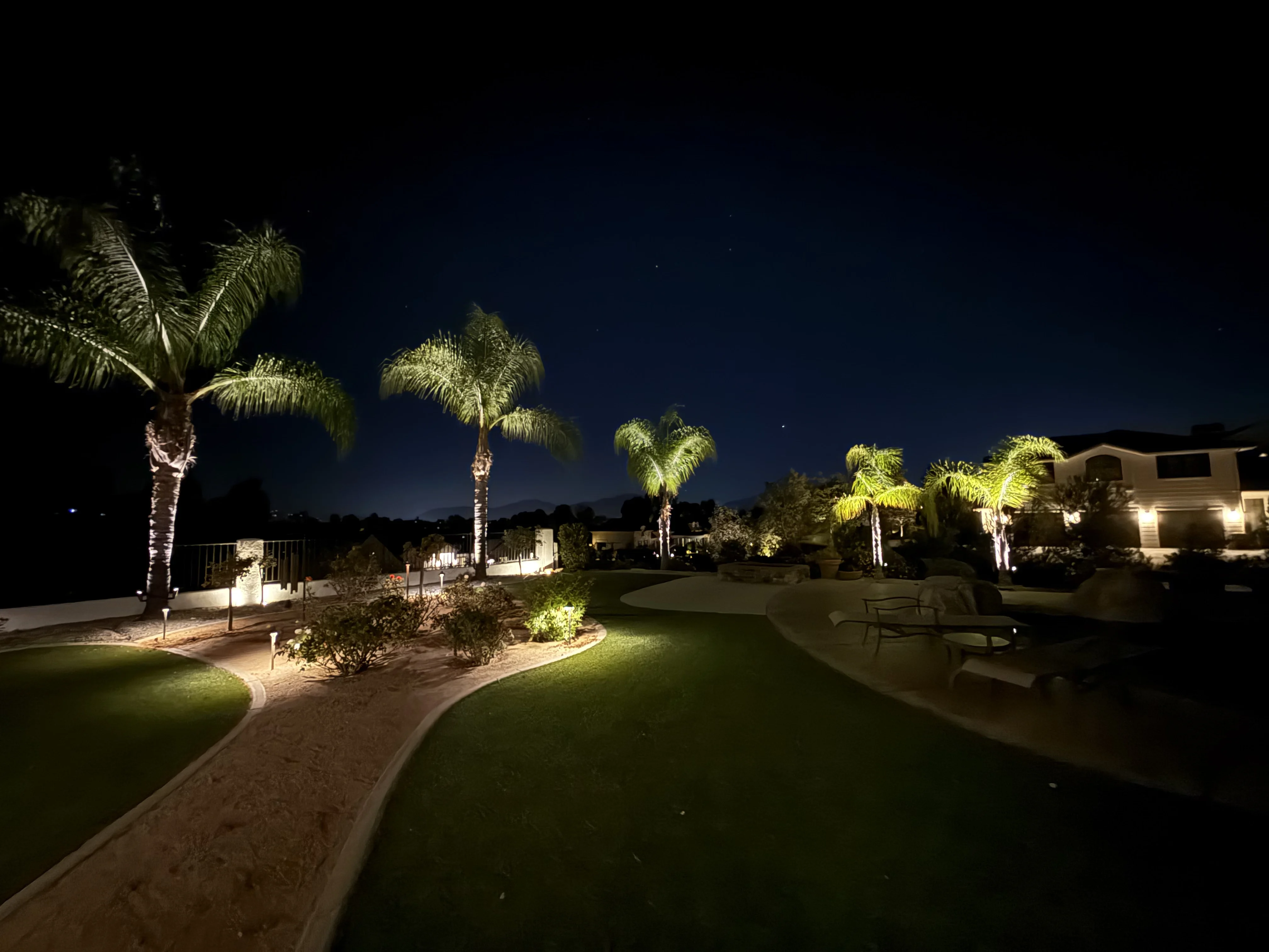 Landscape lighting on a Southern California estate at dusk
